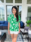 Front of green and white floral top with sleeves