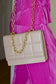 Light beige purse with gold chain