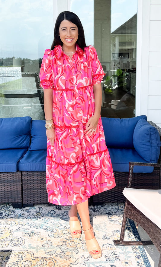 Front of pink floral print midi dress with sleeves 