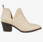 Neutral bone color ankle bootie with v cut out side view